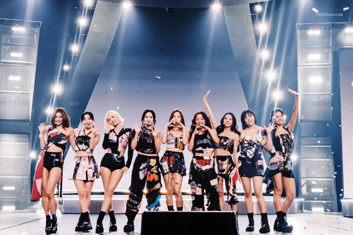 Nayeon with TWICE members on stage during a live performance